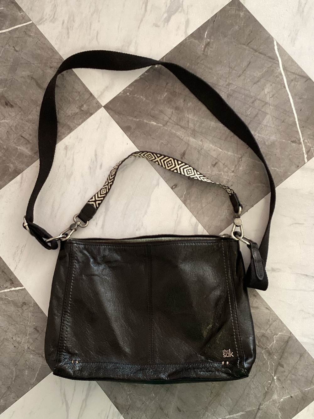 The Sak Black Leather Crossbody Bag with Patterned Strap
